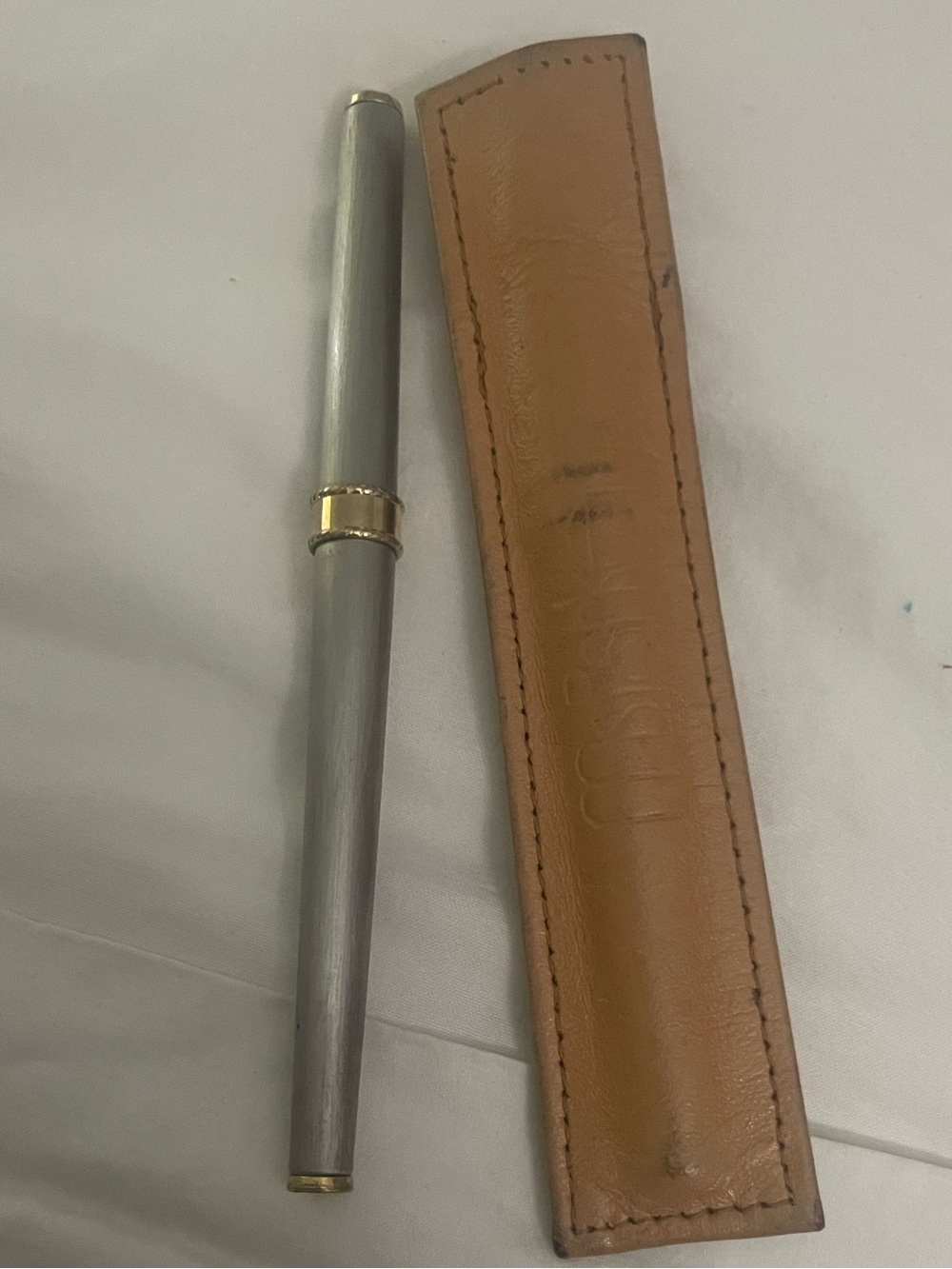 Ms PARKER vintage ballpoint gold and silver tone pen with leather sleeve.
